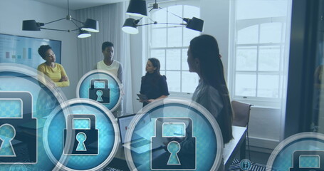 Image of padlock in circles over diverse female coworkers discussing reports in office