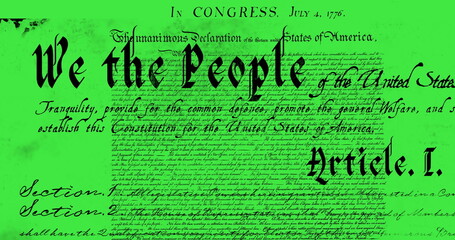 Digital image of a written constitution of the United States moving in the screen against a green ba