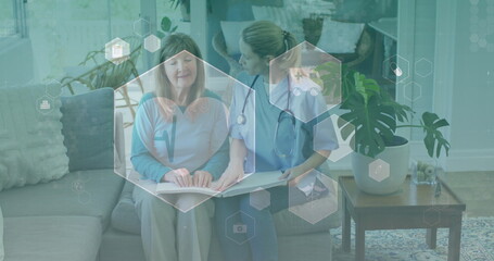 Image of medical icons over senior caucasian woman and female doctor reading braille