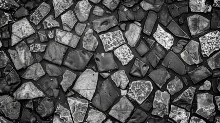 a black and white background composed of irregularly shaped stones, forming an abstract pattern...