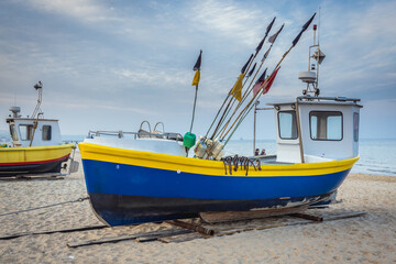 Naklejka na ściany i meble Fishing boats on Baltic Sea beach in Karlikowo District in Sopot city, Poland