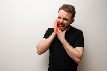 Jaw pain problem concept: bearded hipster middle aged man holds his lower jaw