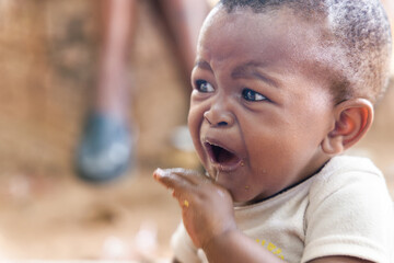 african child crying, toddler in distress, child protection services worldwide