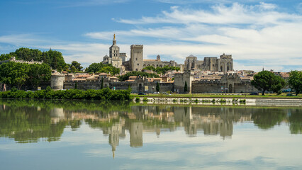 Fototapeta na wymiar Avignon historic town mirroring in Rhone River, popular tourist landmark, Provence, France