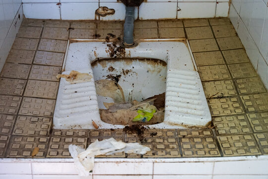 Disgusting dirty wc squat toilet in french city Avignon, France