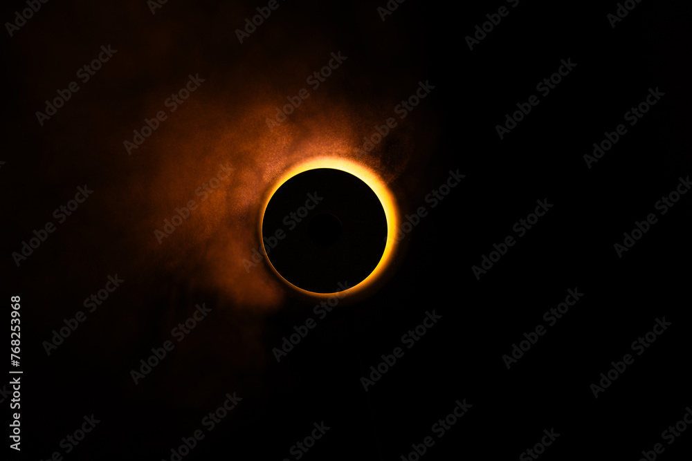 Wall mural eclipse re construction in a studio using a bright flashlight and a round cap with a bit of atmosphe