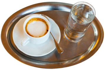 Cup of hot coffee served with glass of clean water for breakfast. Isolated over white background