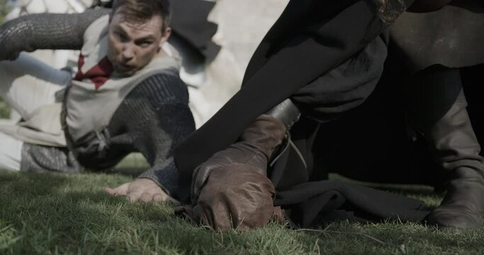 Knight losing precious bag to enemy - low, slow motion shot