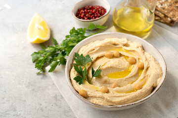 Fresh hummus with chickpea olive oil and limen with multigrain crackers