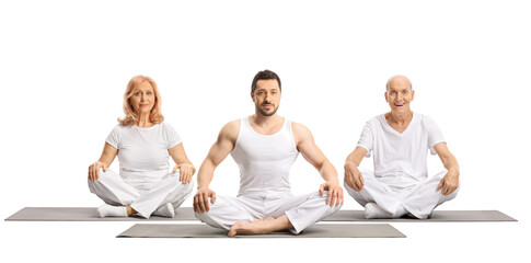 Male yoga instructor on a mat with elderly man and mature woman sitting behind