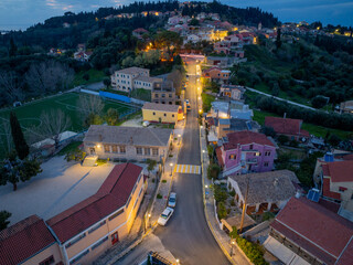 Aerial drone view of beautiful Karousades village by night in north corfu,Greece