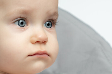 Close up of a baby face with blue eyes