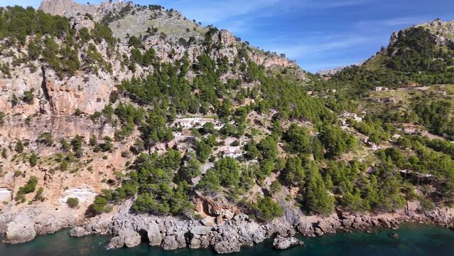Mallorca, turquoise water in bay between mountains aerial drone footage of Cala Tuent