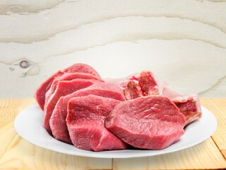 Pork fillet raw meat on wooden board
