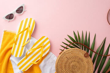 Get ready for summer vibes with this stylish vacation concept! A top view flat lay of yellow striped flip-flops, towel, sunglasses, bag palm leaves on a pastel pink background - Powered by Adobe