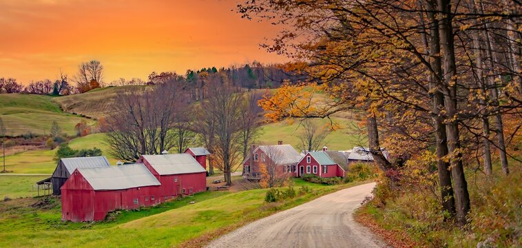 Red house, barn and outbuildings and fall color at a farm, a few miles south of Woodstock, Vermont