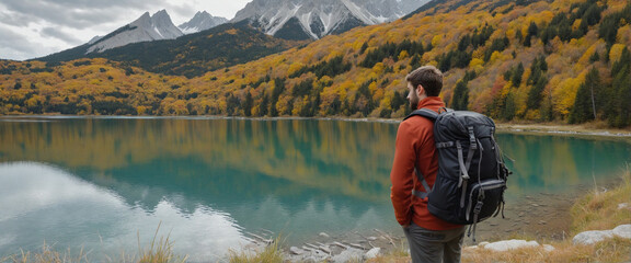 man with backpacks are standing near a mountain lake in autumn - Powered by Adobe