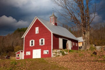 A red barn with coupela in rural Vermont near Strafford