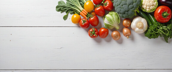 Naklejka na ściany i meble Vegetables arranged on white wooden backdrop