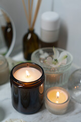 A tranquil home spa ambiance with candles, skincare essentials, and subtle floral touches, creating a serene retreat for self-care rituals and moments of peaceful indulgence.