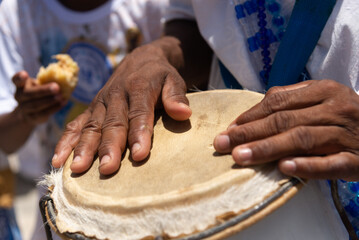 Percussionist hands playing atabaque. African music.