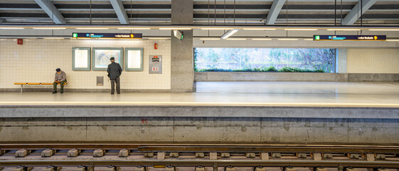 Passengers waiting on the covered platform of Sr.Roubado metro station, Lisbon Portugal.03-03-2024