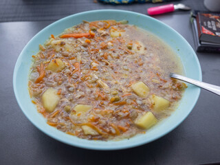 hot vegetable soup in the bowl on the table