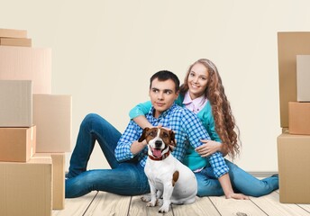 Young couple moving to home with boxes