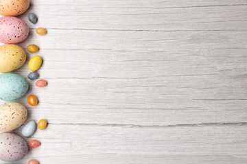 easter eggs on left of frame on wooden surface