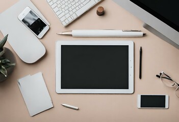 Top view of a minimalist desk with a tablet and pens on it