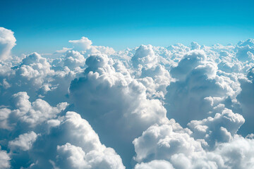 Fototapeta premium photograph as a pattern of fluffy white clouds against a bright blue sky, evoking a sense of calm and openness 