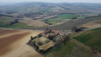 Abandoned Monferrato farmhouse, Cuccaro, Alessandria, Piedmont, Italy from drone