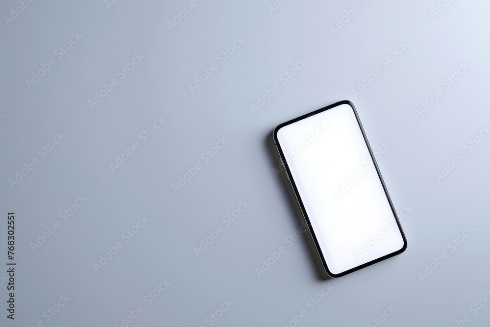 Aufkleber a direct aerial view of a modern smartphone on a solid gray background, signifying high-tech and dig