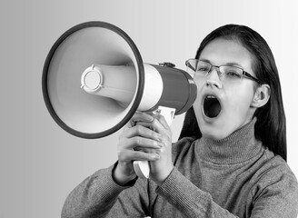 Black and white young woman shouting in megaphone