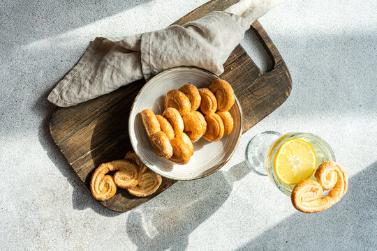 Palmiers or elephant ears, puff pastry cookies in the bowl