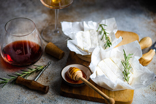 Gourmet Brie Cheese Selection with Honey and Wine