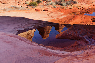 Reflection Of Red Rock Formations In Small Pool - Powered by Adobe