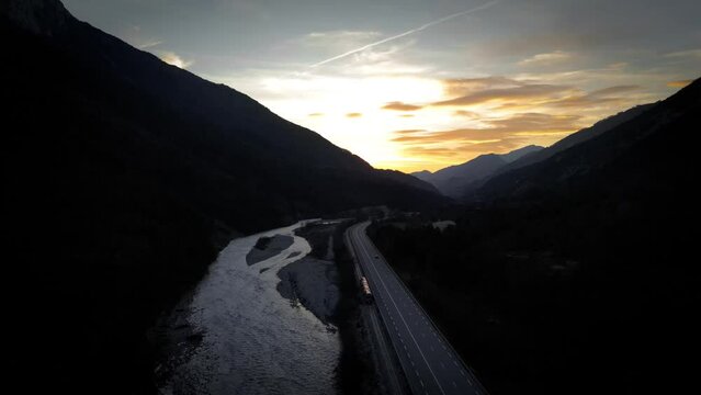 View of a valley during a sunset, landscape with a train and a road, south of France. 4K drone video