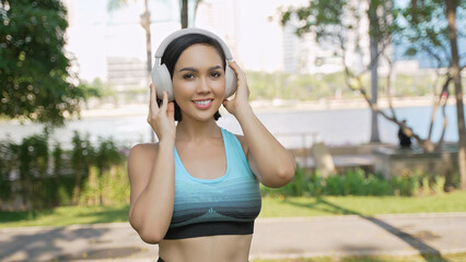 Active Woman Enjoying Music During Park Workout