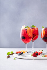 Refreshing summer sangria with berries and fruits with red wine
