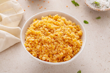 Cooked red lentils in a bowl, healthy vegan protein source
