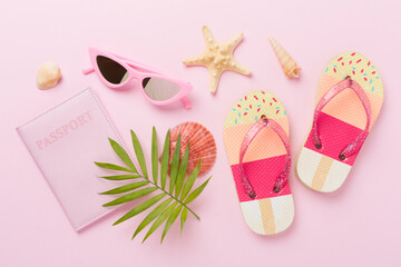 Bright flat lay with travel accessories on color background, top view