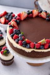 Classic cheesecake with chocolate ganache and fresh berries