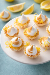 Obraz na płótnie Canvas Lemon meringue tartlets in filo pastry shells