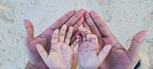 wrinkles on boy's fingers after swimming in the sea. A boy's hands aftet playing water. The fingers are wet and a little bit wrinkle