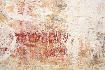 The tonal range from red to pink to cream of this background wall is offset by the deeply textured medium of cement.