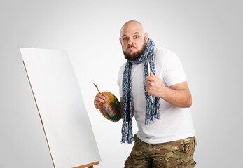 Young artist painting Using easel