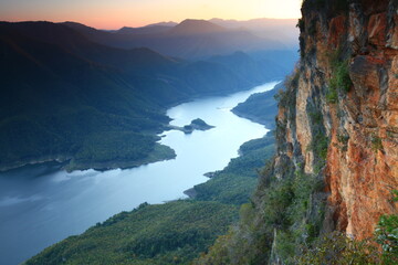 Pha Daeng Luang ,it is a reddish - orange cliff, majestic alongside the Mae Ping River that flows...