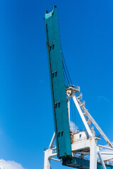 Gantry crane arm on the blue sky background. Container terminal of Miami sea port.