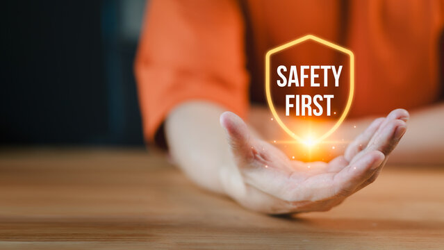 People presenting the safety banner symbol, highlighting a commitment to workplace safety, zero accidents, and fostering a culture of hazard awareness among workers.